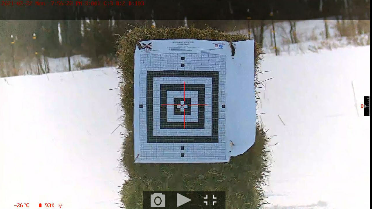 target on hay bale in snow