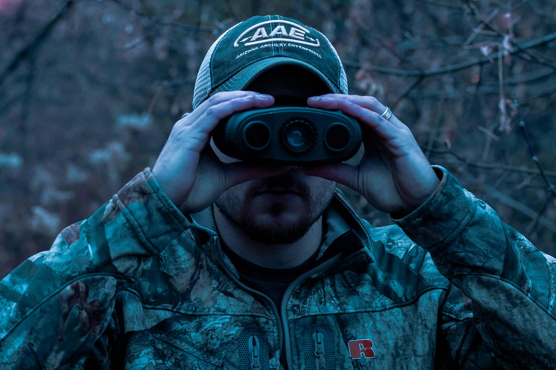 man using Night vision binoculars